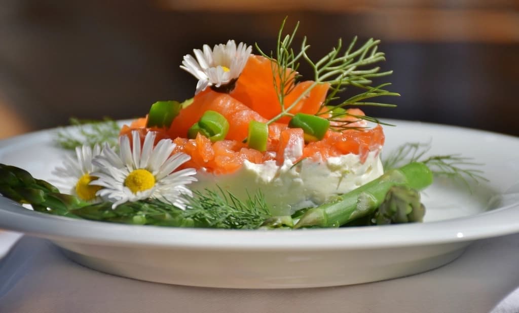 Salmon tartare decorated with edible flowers