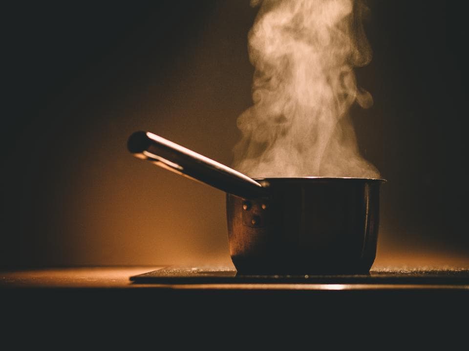 Steam rising from a pot on the stove